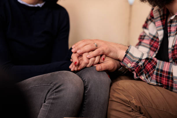 istock Married people holding hands at couple therapy session 1421294913
