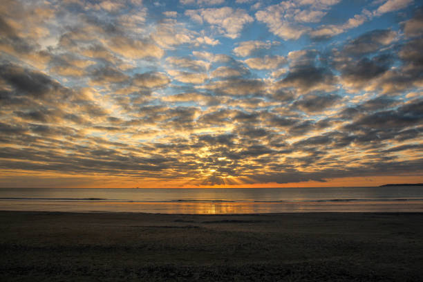 istock Sunset over the ocean 1421295023
