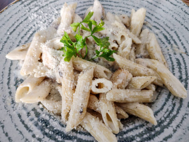 istock Pasta with white sauce and mushrooms 1421295349