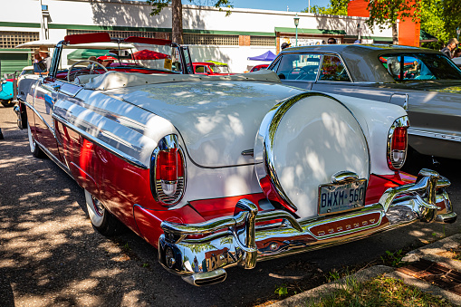 Falcon Heights, MN - June 17, 2022: High perspective rear corner view of a 1956 Mercury Montclair Convertible at a local car show.