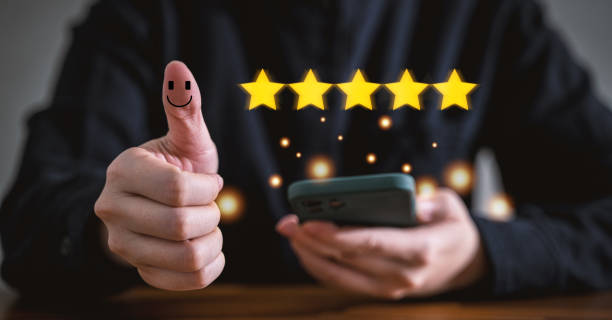 istock Customer rate their satisfaction ranking for experience review survey with smart phone and laptop. 1421300021