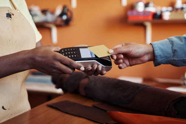 istock Client Paying in Small Business Shop 1421304098