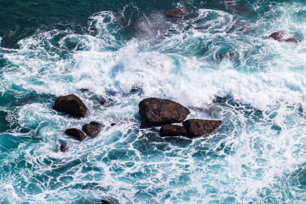 Turquoise ocean waves break on the coastal rocks, Sri Lanka, vacation time