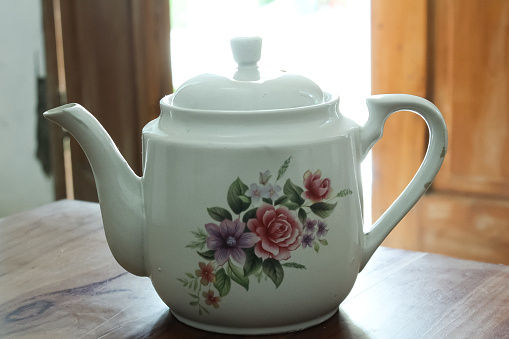 Floral ceramic teapot, beautiful food utensils