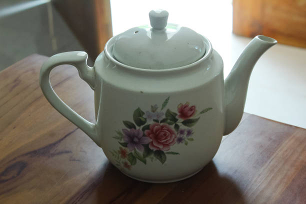 istock Floral ceramic teapot, beautiful food utensils 1421304246