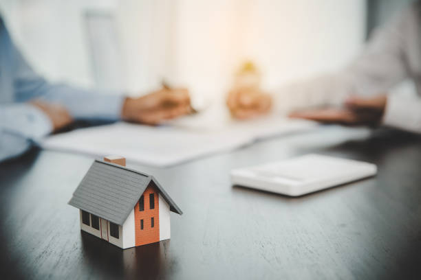 istock Broker advisor consulting a client. Real estate agent offer hand for customer sign agreement contract signature for buy or sell house. Business mortgage concept and insurance home 1421304253