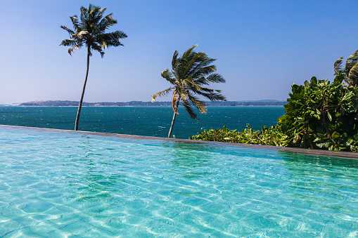 Beautiful turquoise pool overlooking the endless blue ocean. Malima. Sri Lanka. Mirissa