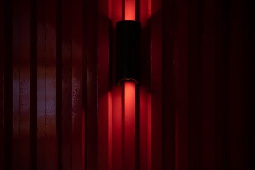 Lighting effect of red metal vertical background wall