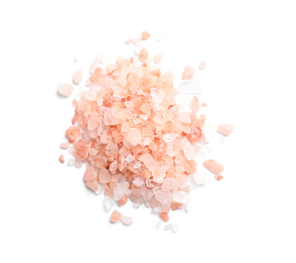 istock Heap of pink Himalayan salt on white background, top view 1421305461