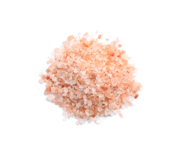 istock Heap of pink Himalayan salt on white background, top view 1421307939