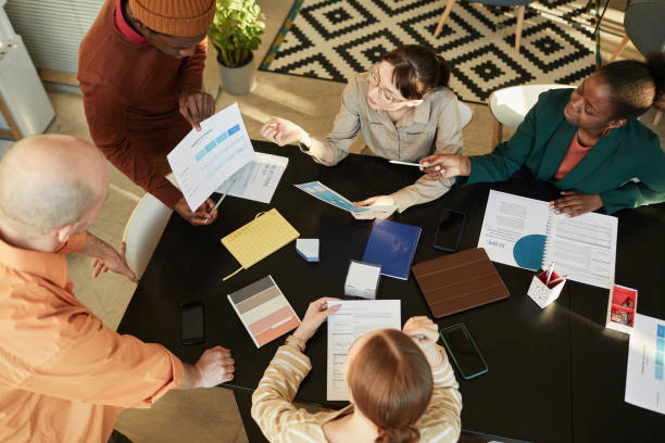 istock Team Brainstorming Ideas In Meeting 1421308966