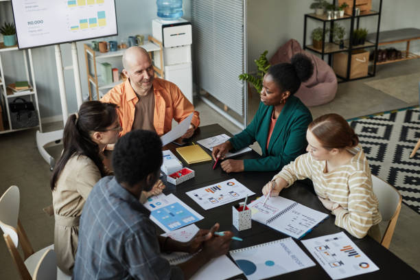 istock Diverse Business Team Meeting At Table 1421308999