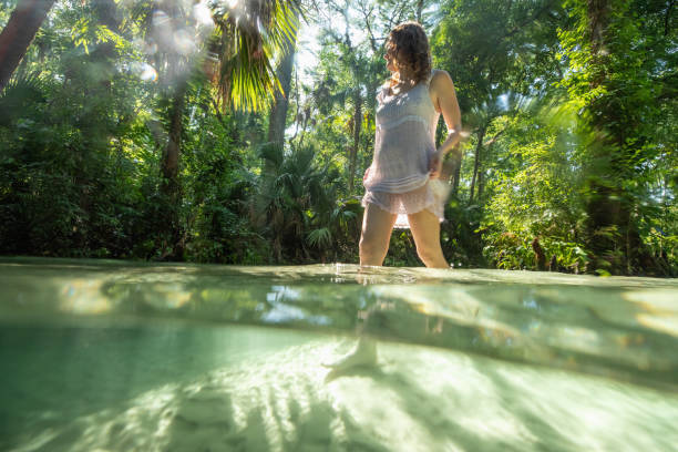 istock Woman enjoying her Florida vacation 1421310577