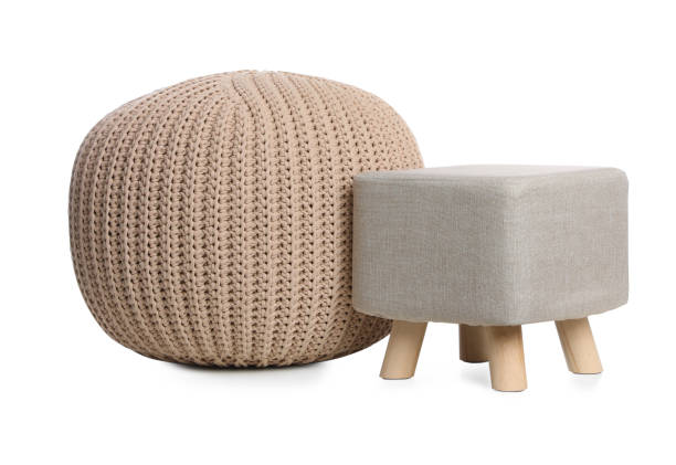 Stylish pouf and ottoman on white background. Home design