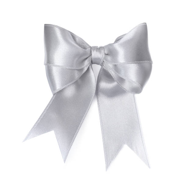 istock Silver satin ribbon tied in bow on white background, top view 1421313806