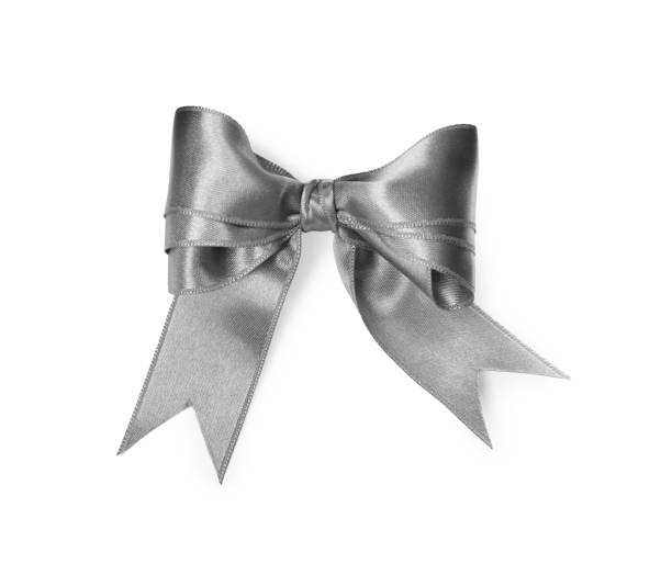 istock Silver satin ribbon tied in bow on white background, top view 1421314046