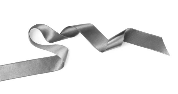istock Silver satin ribbon on white background, top view 1421314117