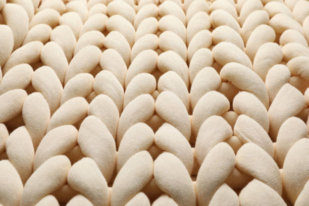 istock Chunky knit blankets as background, closeup view 1421314925