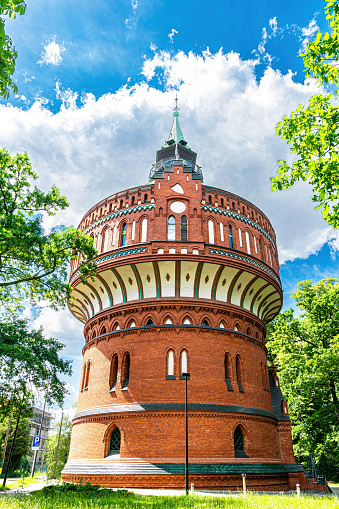 Ancient brick water tower in Bydgoszcz, Poland. Historical industrial building and famous tourist landmark