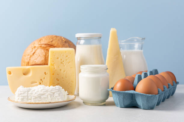 istock Variety of dairy products on blue background 1421318443