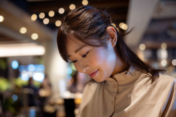 istock Female freelance worker eating dessert in cafe 1421319047