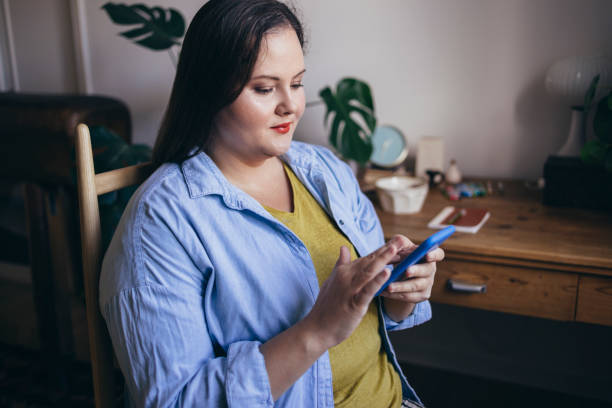 istock Woman Browsing Her Social Media 1421320526