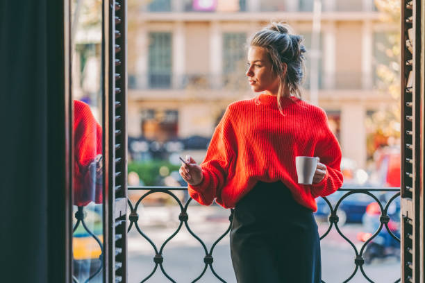 istock Relaxed woman smoking at the terrace 1421320598