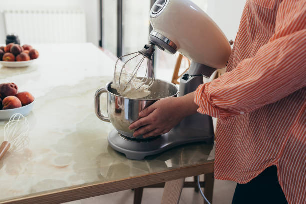 istock Anonymous Woman Making Whipped Cream 1421320658