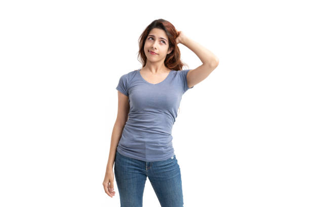 istock Woman on white background thinking 1421325117