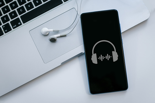 Streaming online music concept. Sound player app on smartphone. Listen podcast, internet download