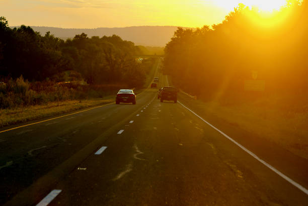 Bluemont, Virginia, USA - September 3, 2022: Traffic travels on Route 7 westbound as the sun sets in the distance over the Shenandoah Valley in rural Northern Virginia.