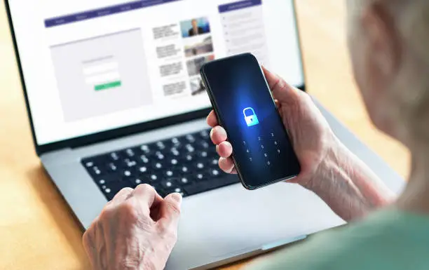 Photo of Senior and phone with lock password to protect data in online bank website. Old woman with smartphone. Cyber security and personal information safety and privacy from hacker fraud.