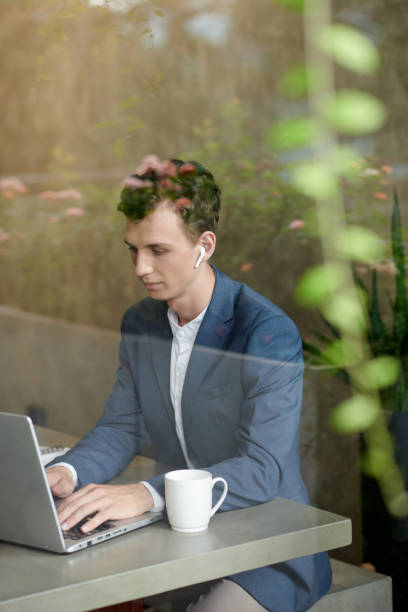 istock Young Businessman Working on Laptop 1421330037