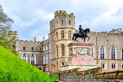 Windsor, UK - April 2018: Walls and towers of Windsor Castle