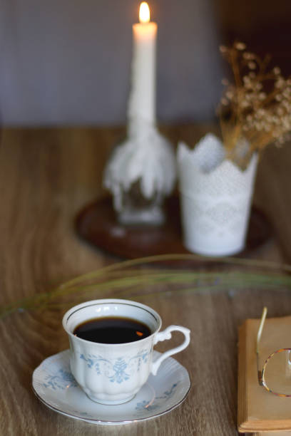 istock Tea, Cookies, Book, Candles and Lavender 1421335395