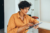 istock A Happy Beautiful Freelancer Reading Something On Social Networks Using Her Tablet 1421336388