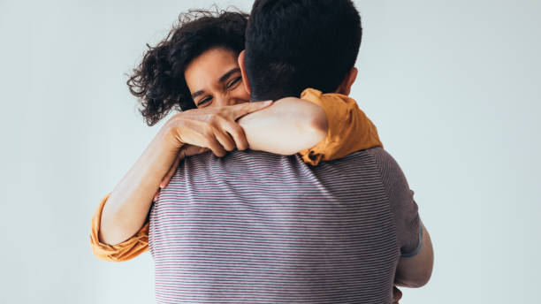 istock Love Is In The Air: A Beautiful Happy Couple Hugging And Laughing 1421336402