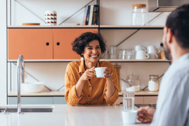 istock A Happy Couple Drinking Tea In The Kitchen, Talking And Laughing 1421336521