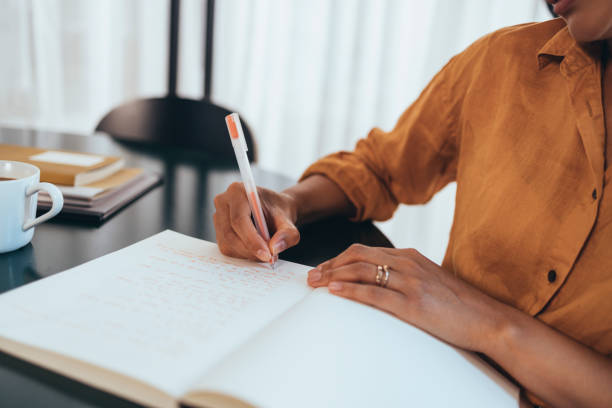 istock An Unrecognizable Businesswoman Holding A Pen And Writing Some Notes 1421336618