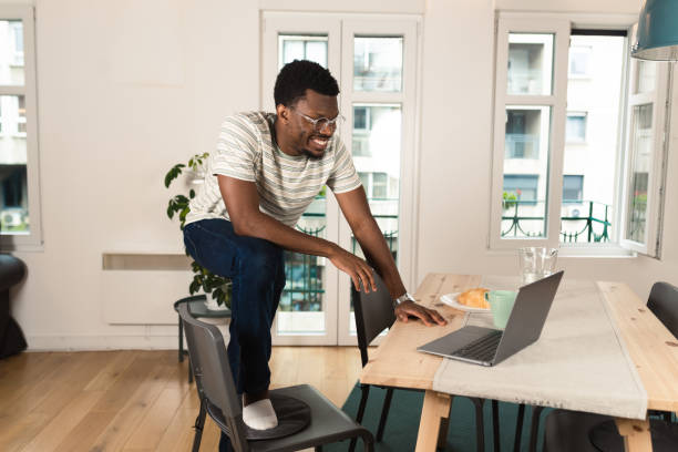 istock Young African-American designer working at his home office 1421336893