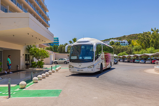 Rhodes. Greece. 08.25.2022. Beautiful view of tourists buss near hotel building.