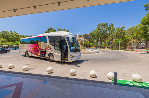 Rhodes. Greece. 08.25.2022 Beautiful view of tourists buss near hotel building.