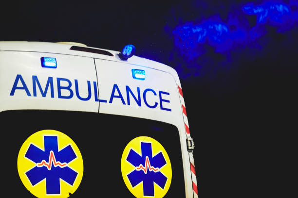 istock Ambulance rushes through the dark starry night. 1421347984
