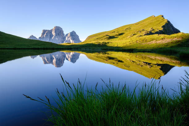 Monte Pelmo reflected on calm Lago delle Baste. Mondeval, Dolomites in Italy