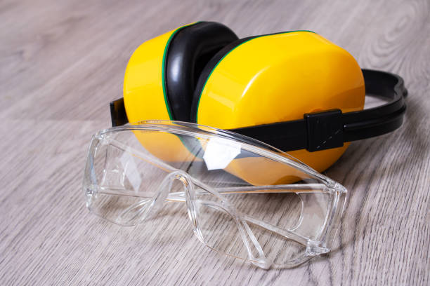 istock Protective construction glasses and headphones close up 1421348508