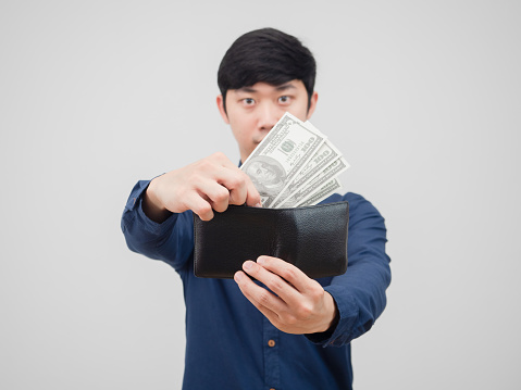 Man pick up money from his wallet on white background