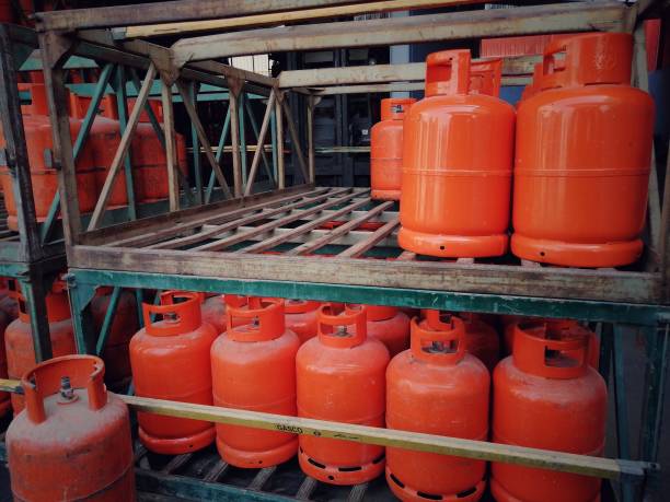 istock Stack of orange color LPG gas cylinder 1421351495