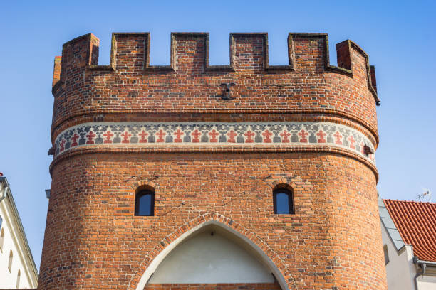 Red brick Mostowa city gate in Torun, Poland
