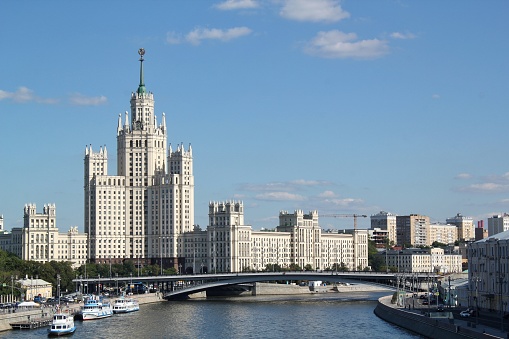 Sunny spring day in Moscow. Moskvoretskaya embankment. Blue sky with fluffy clouds is on the background.