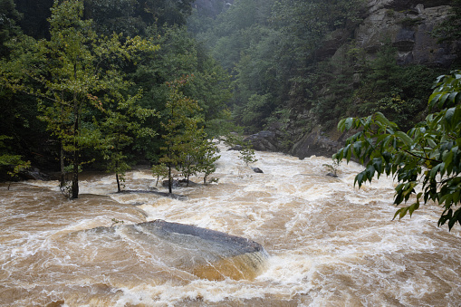 Maximum water flow through Tallulah Gorge State Park due to heavy rainfall and flash flooding, resulting in an emergency dam release.